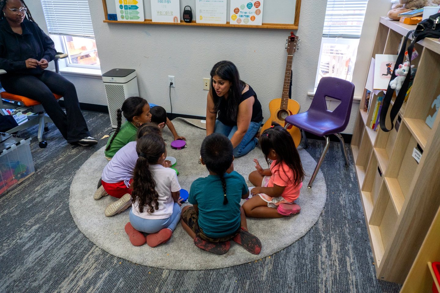 Students and staff sitting in a circle during a Hope Horizon afterschool session